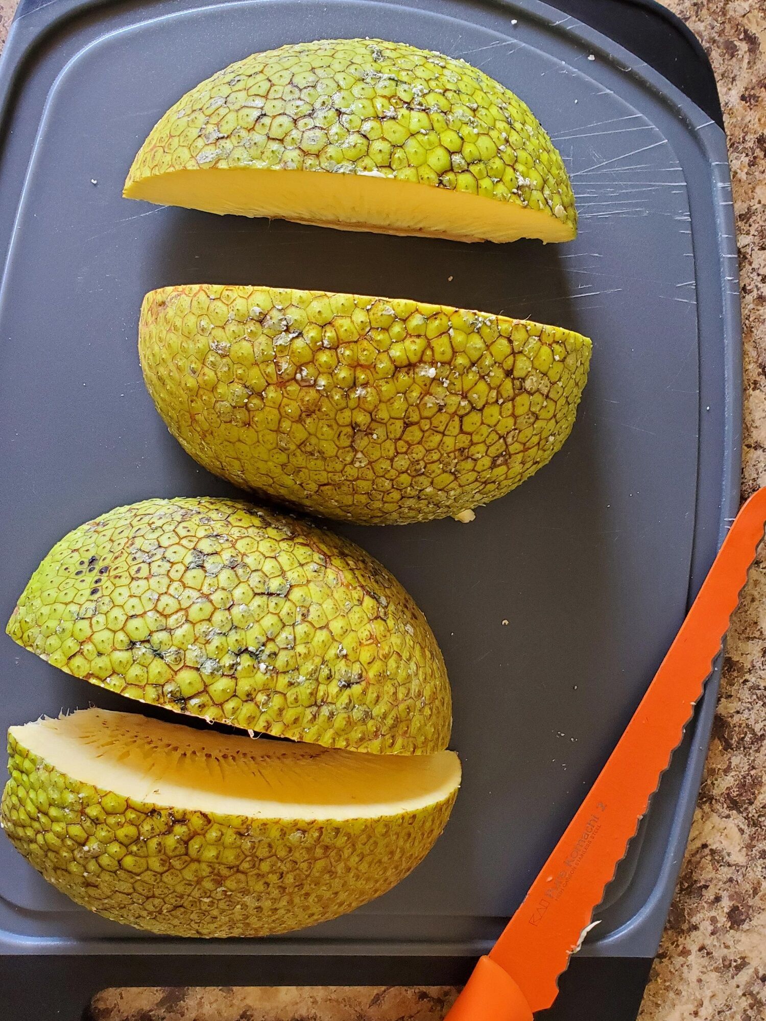 photo of a breadfruit cut into fourths